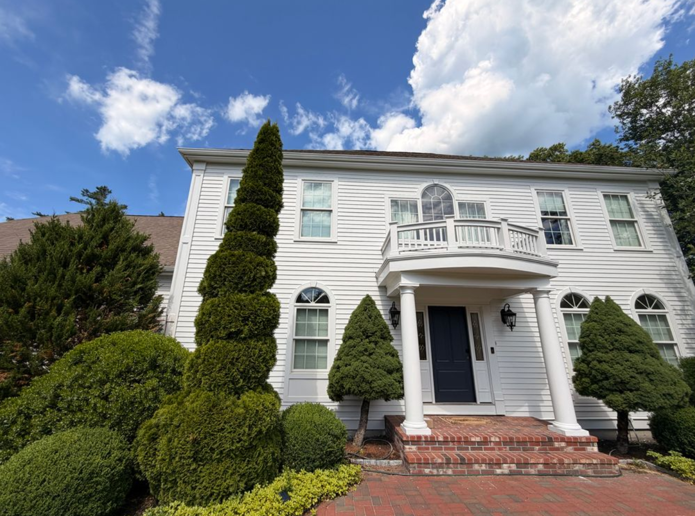 Completed white exterior house painting project by PTG Painting LLC in Norwell, Massachusetts