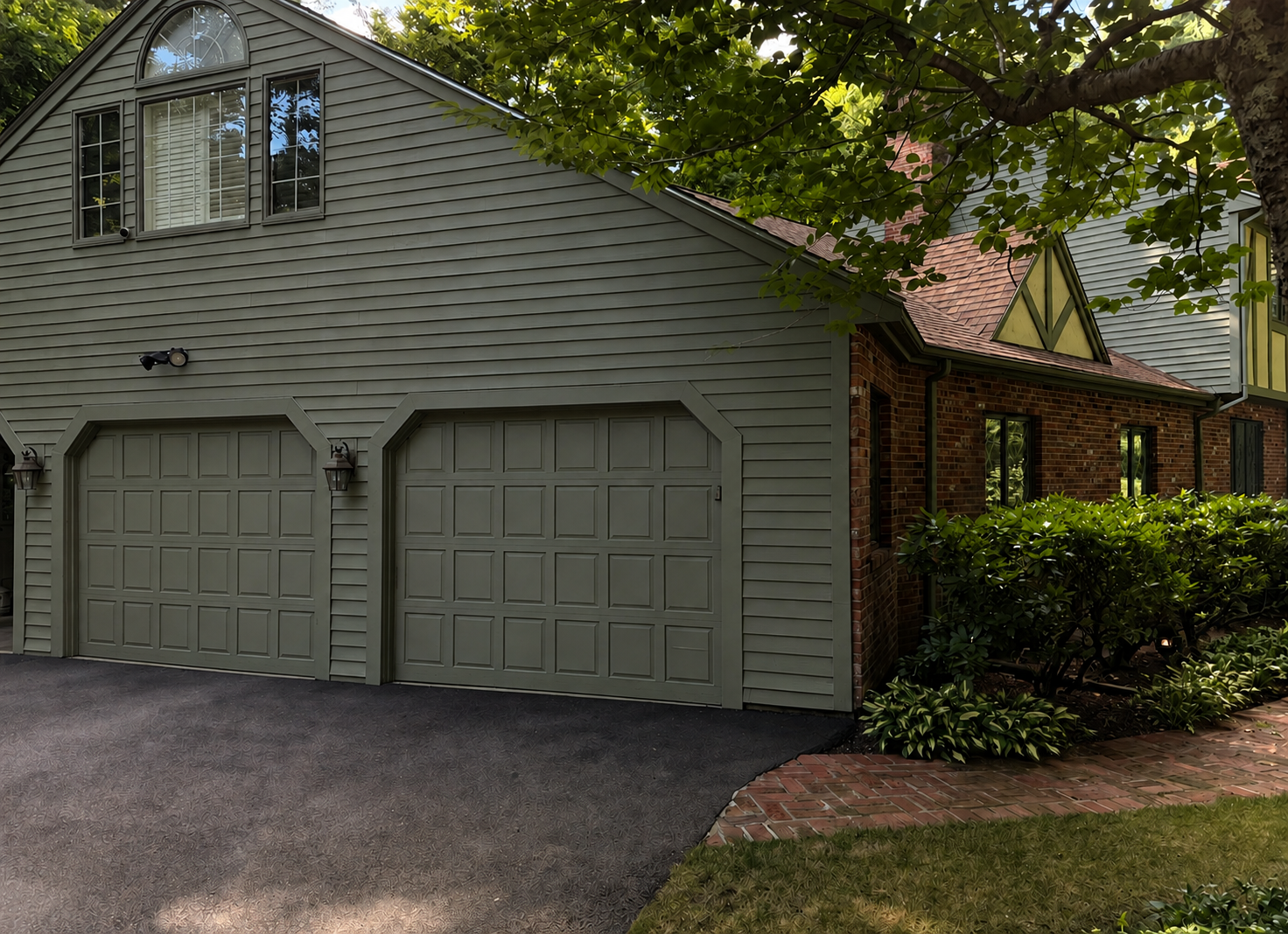 Freshly painted garage doors, siding, and exterior trim completed by PTG Painting LLC in Walpole, Massachusetts