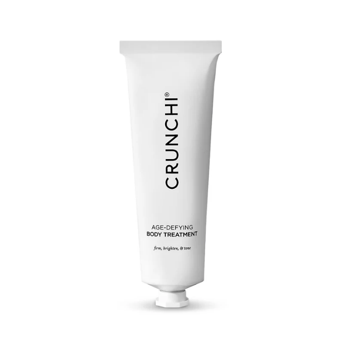 A white tube of Crunchi Age-Defying Body Treatment standing vertically on a white background.