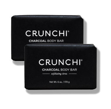 Two black Crunchi charcoal body bars stacked against a white background. Each label reads 