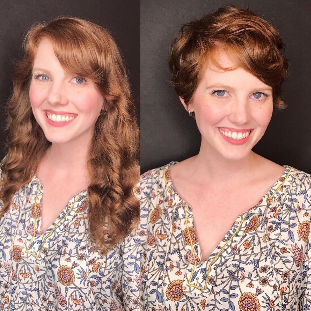 A woman with long hair and a woman with short hair are smiling for the camera.