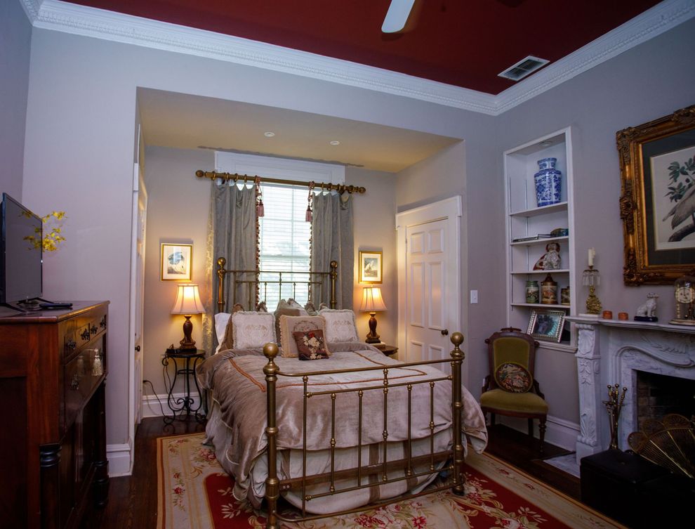 there is a large bed in the middle of the room .