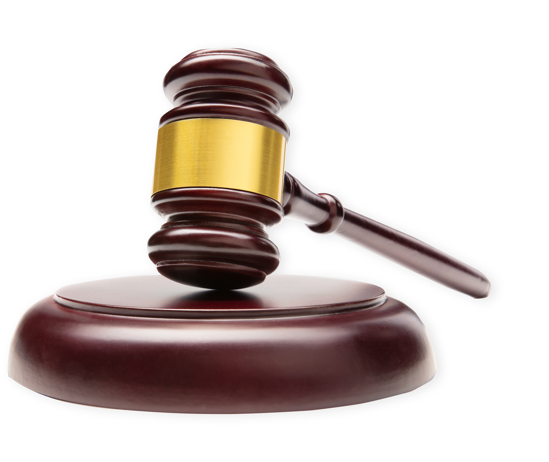 Wooden gavel on a round wooden block, with a gold band on the mallet.