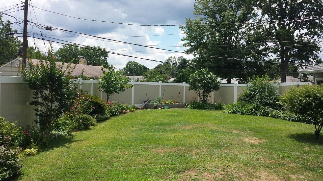 Vinyl Fence In A Garden — Hatboro, PA — Main Street Fence