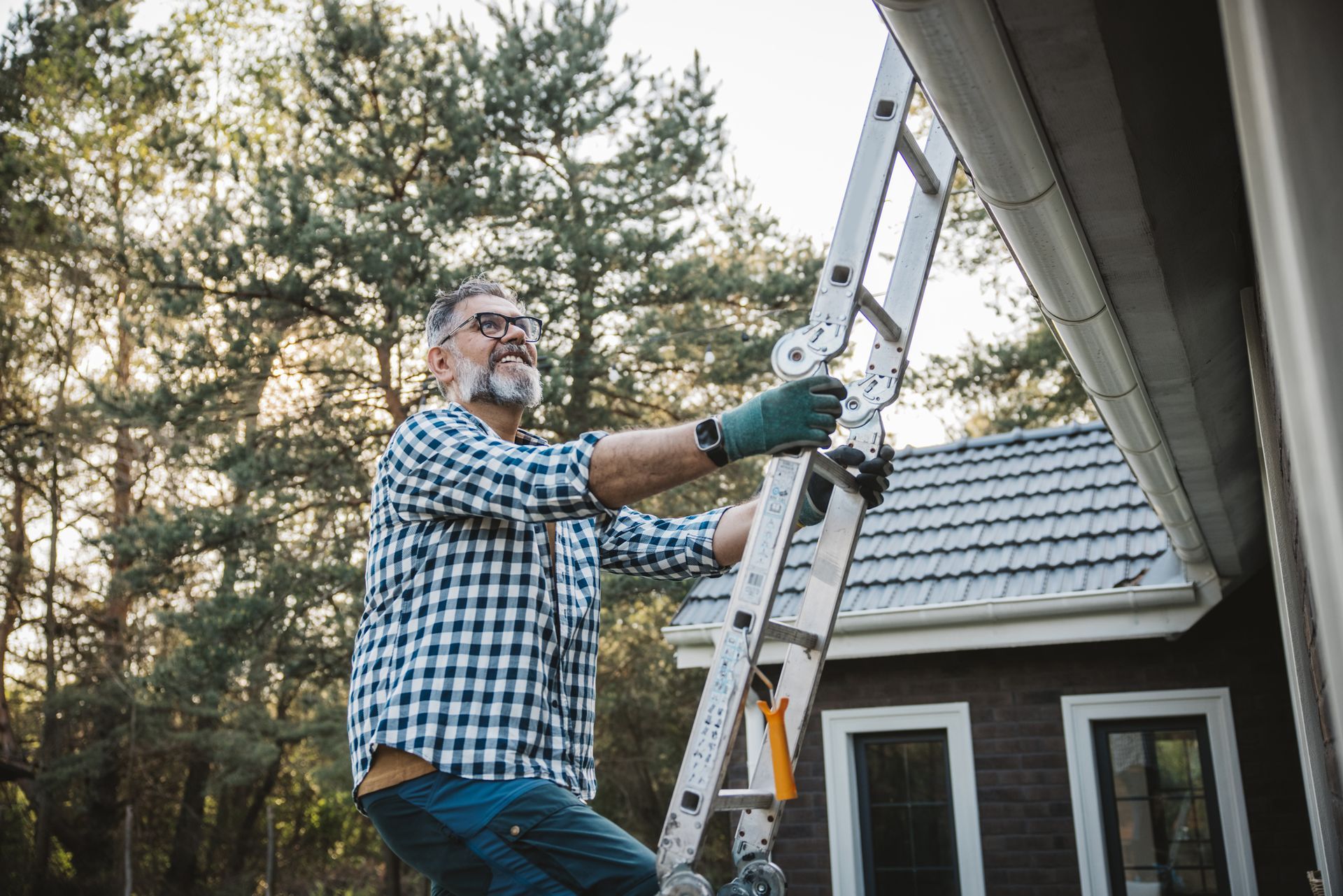 Man Is Climbing Ladder - Pearl, MS - Southern Gutters LLC