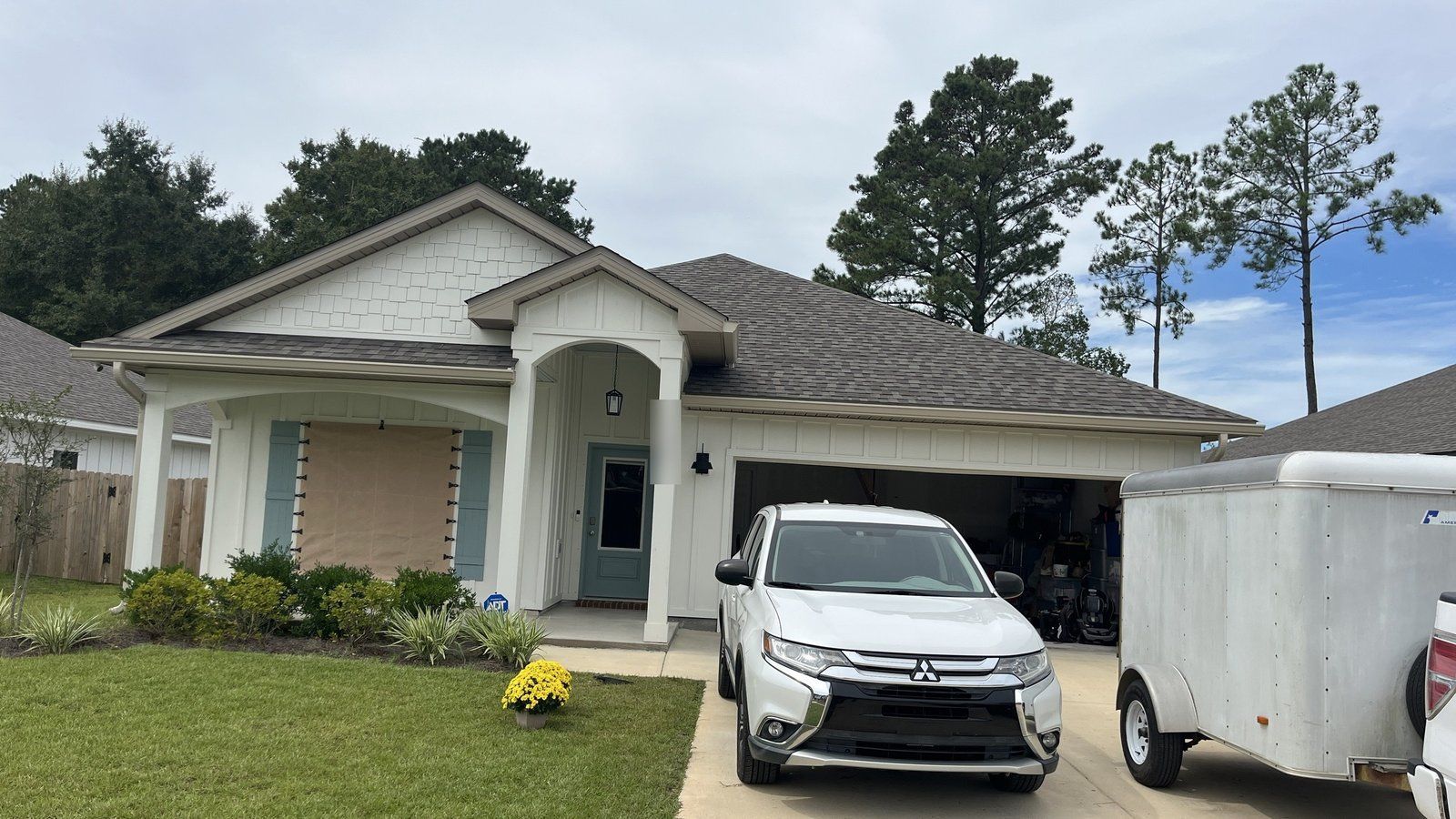 Front of a single-story home in Mobile, AL showing the roofline, fascia and gutters