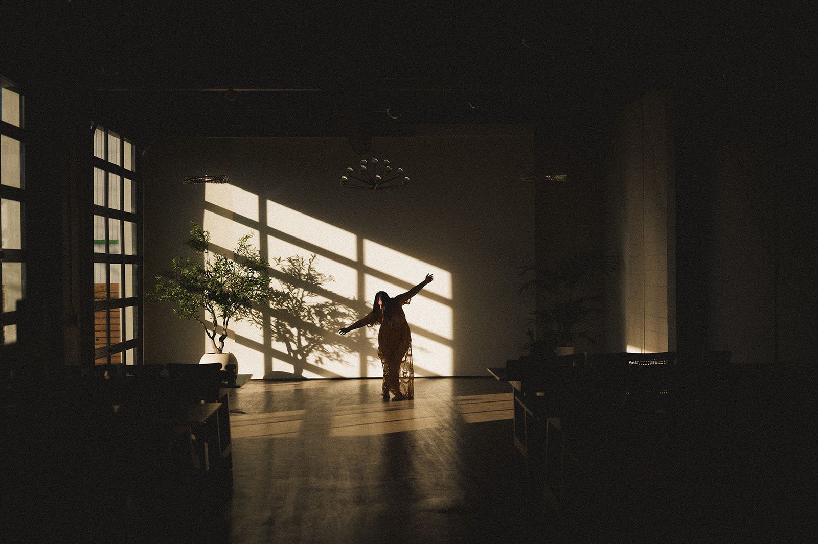 Woman dancing inside the main hall at Bestow Events in Longmont, CO.