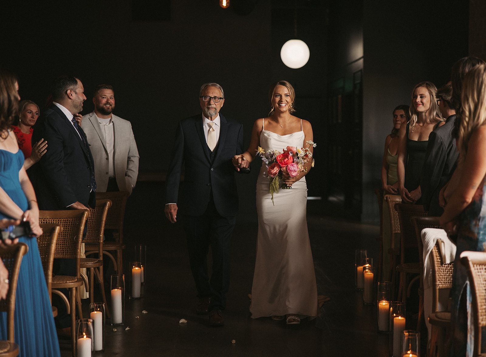 Bride walking down the aisle during her wedding at Bestow Events in Longmont, CO.