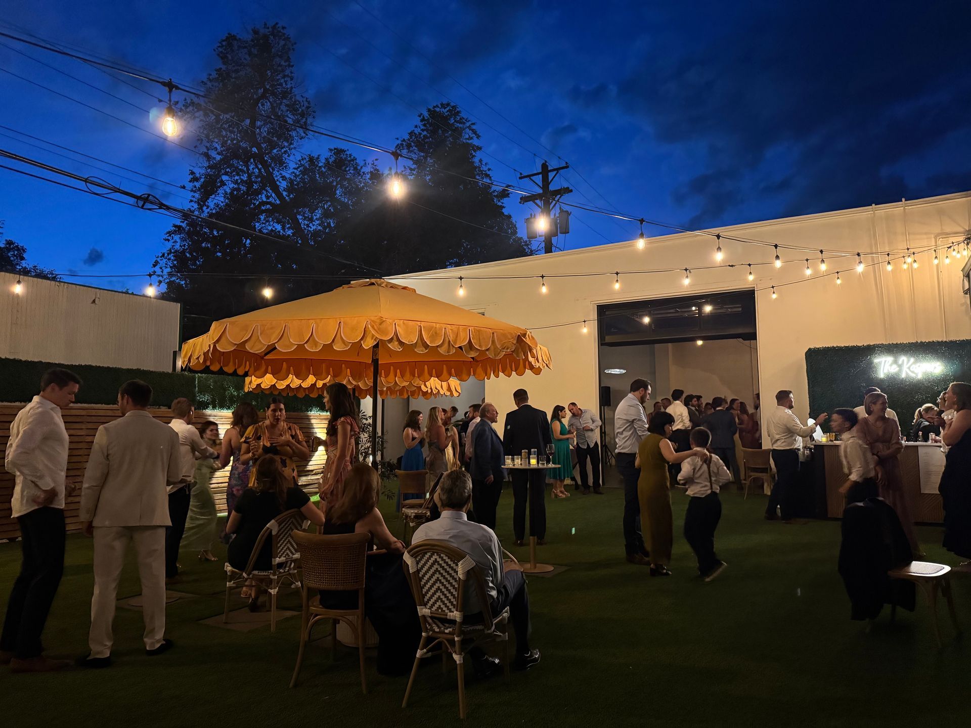 Guests enjoying outdoor wedding reception at Bestow Events in Longmont, CO.