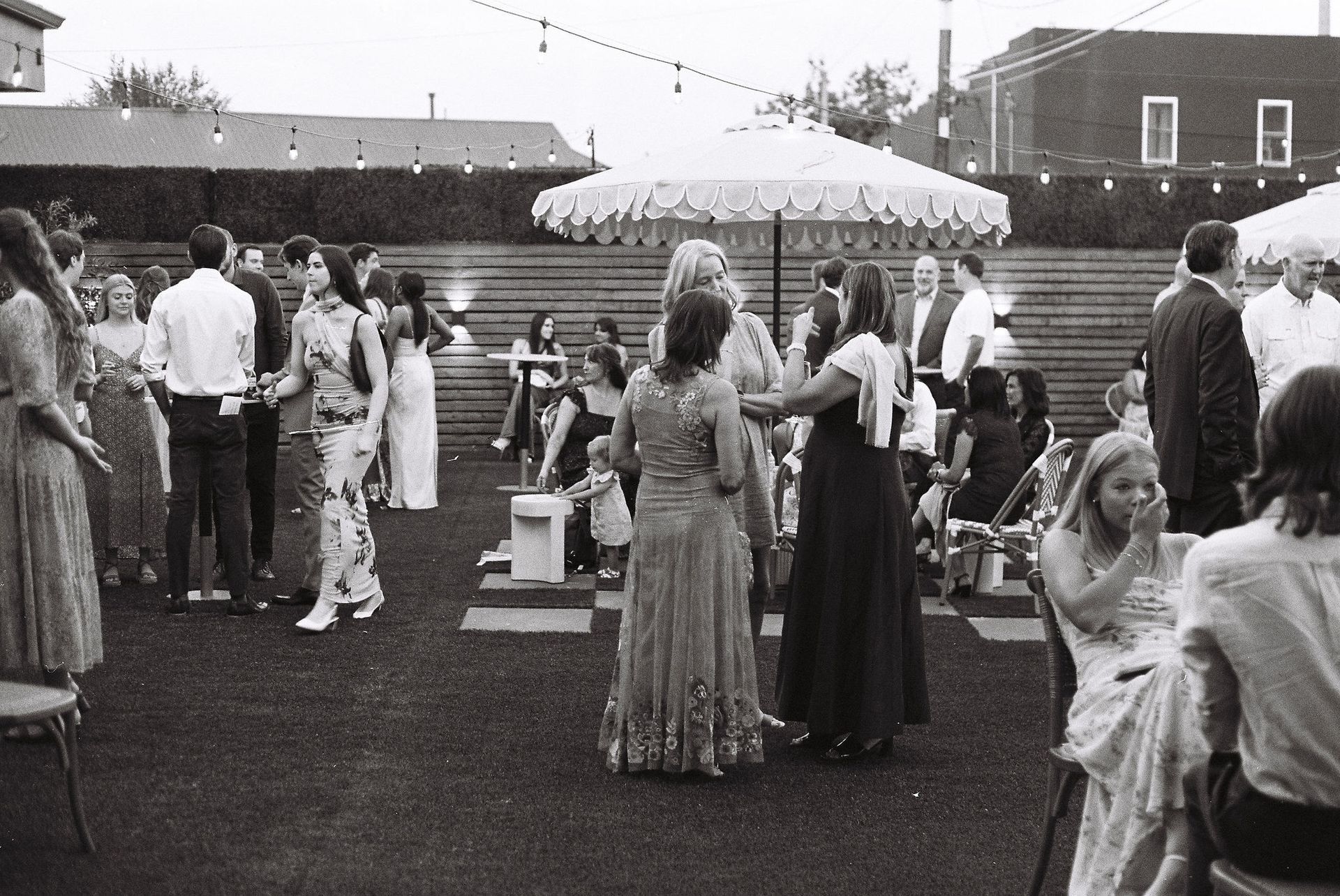 Guests enjoying outdoor wedding reception at Bestow Events in Longmont, CO.