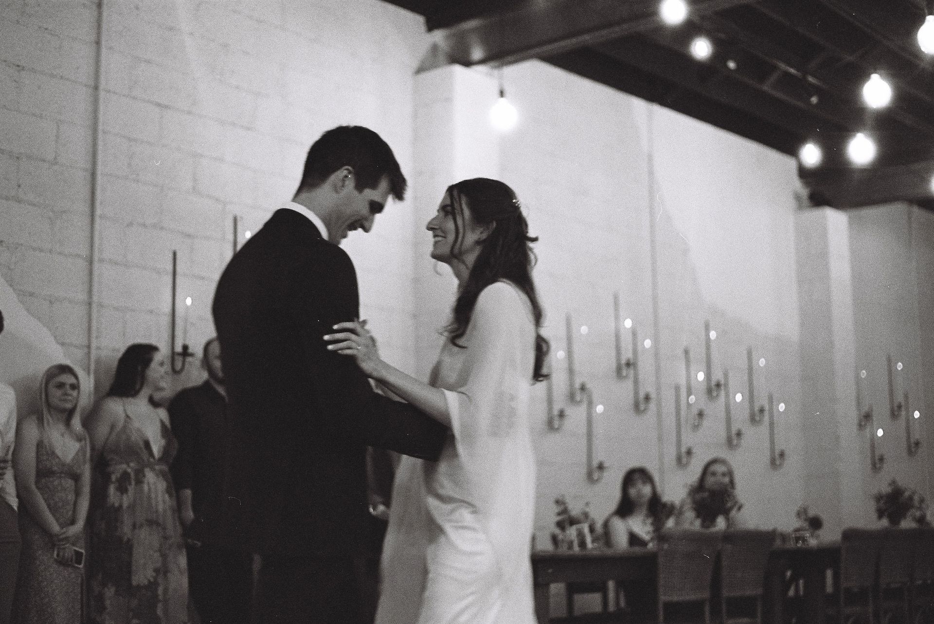 Bride and groom enjoying their wedding reception at Bestow Events.
