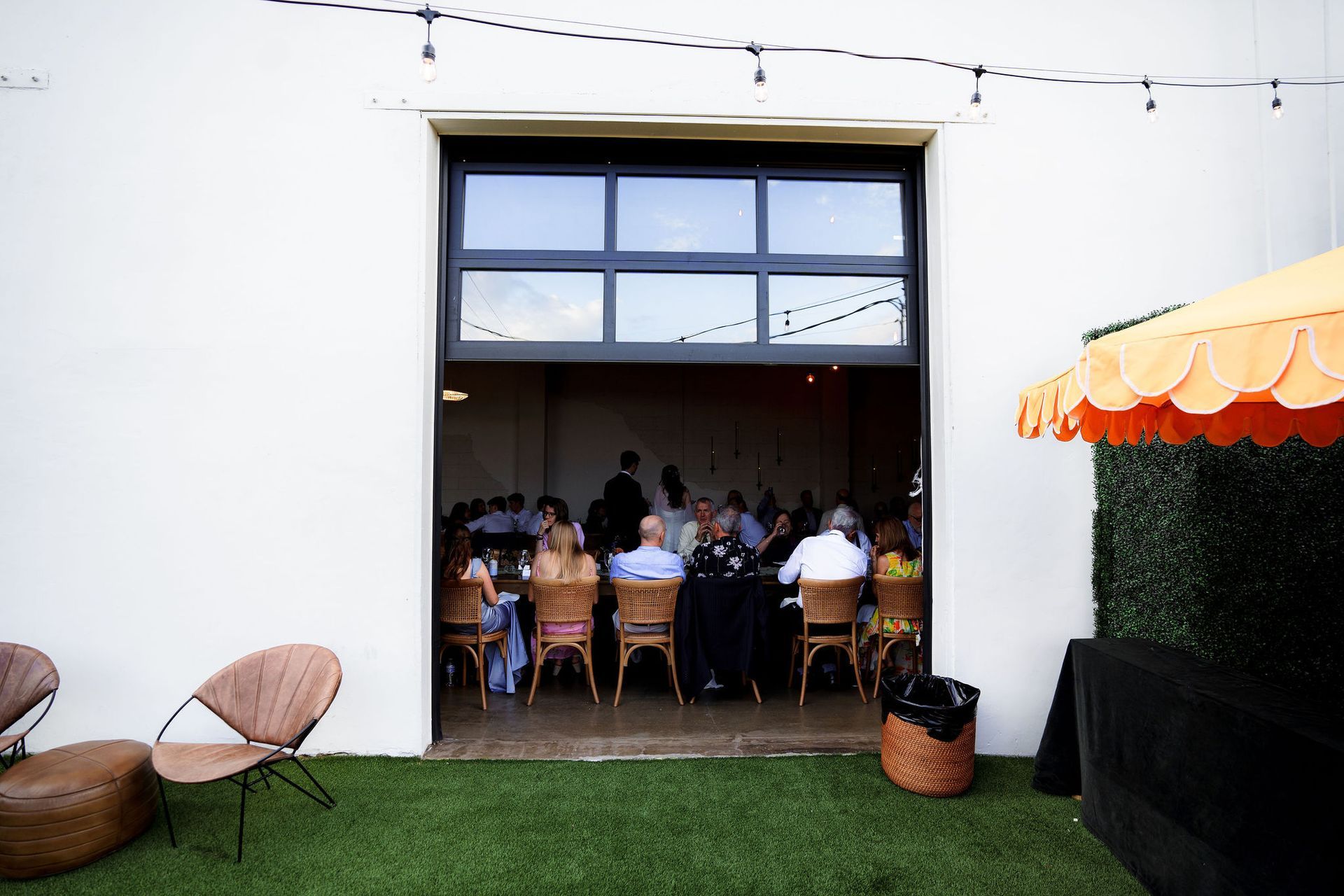 Indoor/outdoor wedding reception at Bestow Events in Longmont, CO.