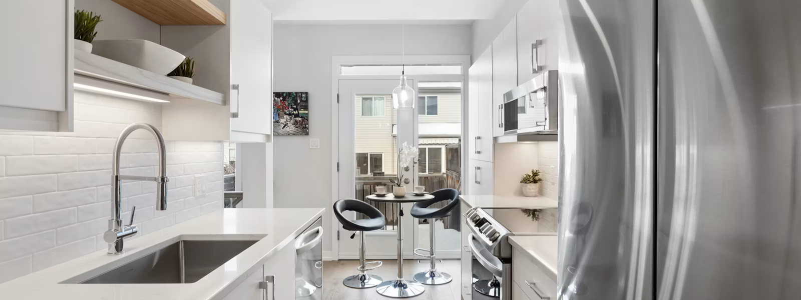 appliance repair Fresno CA, modern kitchen with stainless steel refrigerator and oven serviced.