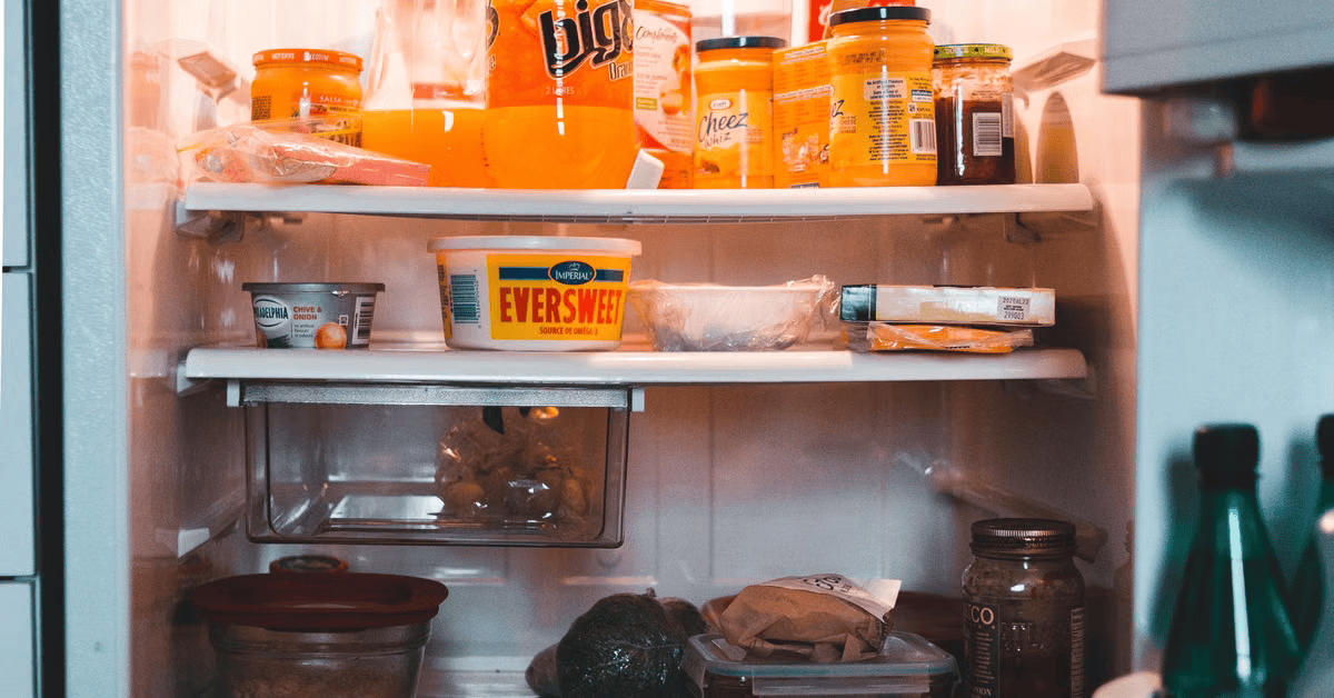 Refrigerator and freezer stocked with fresh food in a Fresno kitchen, deep freezer repair