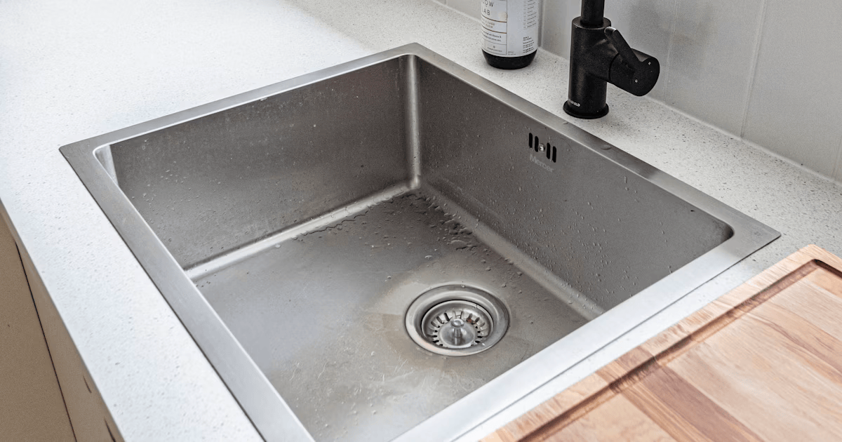 Garbage disposal maintenance in Fresno - clean stainless steel kitchen sink - Bauman's Appliance