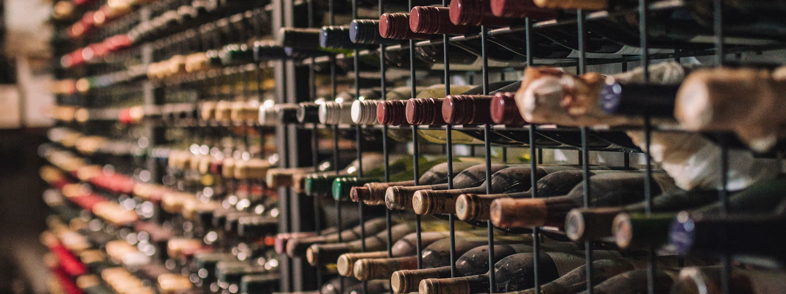 Wine coolers repair Fresno CA - rack of chilled wine bottles in a wine cooler - Bauman’s Appliance