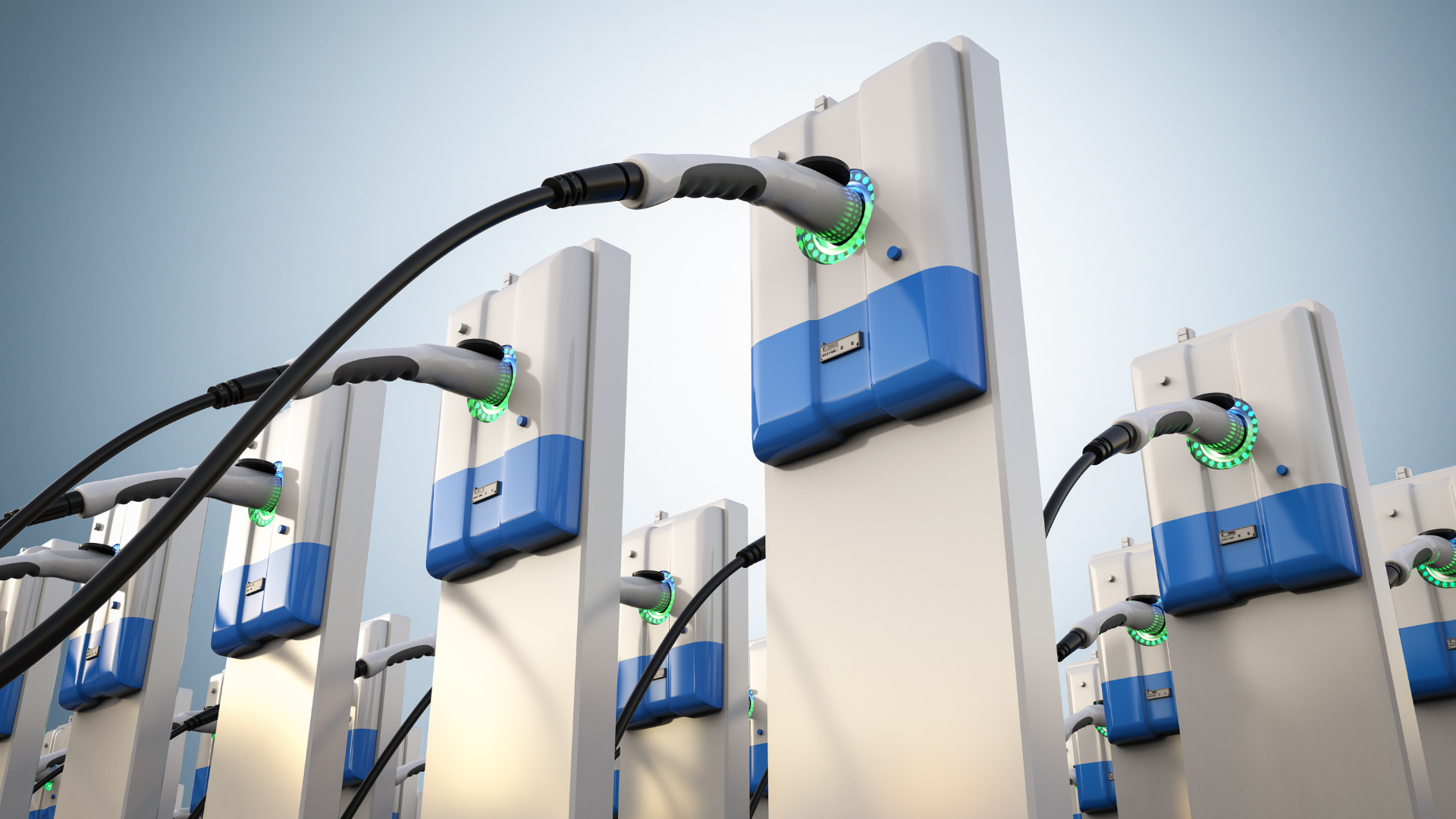A bunch of electric cars are being charged at a charging station.