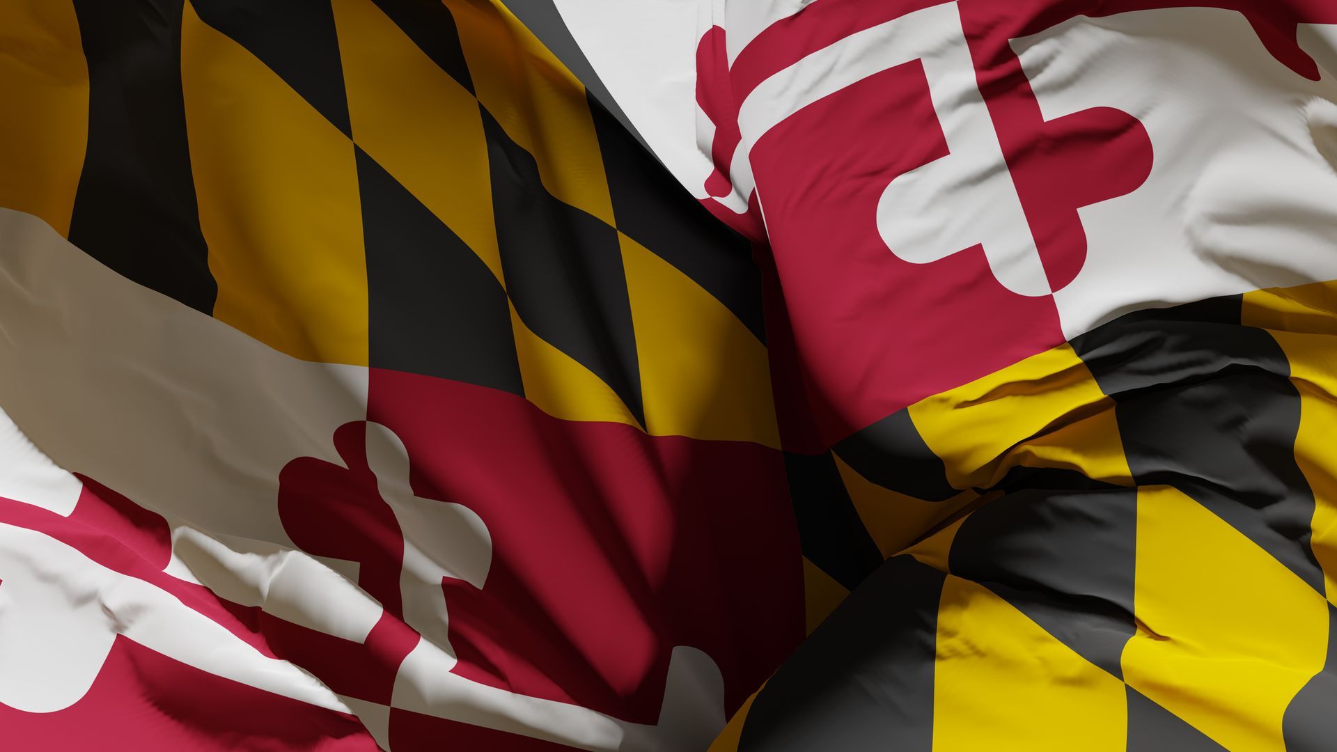 Bandera del estado de Maryland, diseño de cruz roja y blanca con diseño de diamantes amarillos y negros, tela doblada.