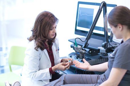 Dr. Mahajan prepares patient for neuro-diagnostic testing