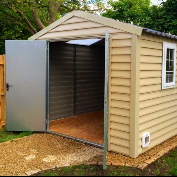 A shed with the door open and a window