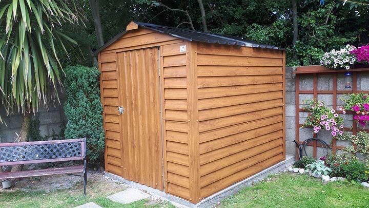 Installed timber garden shed in a carefully prepared garden setting