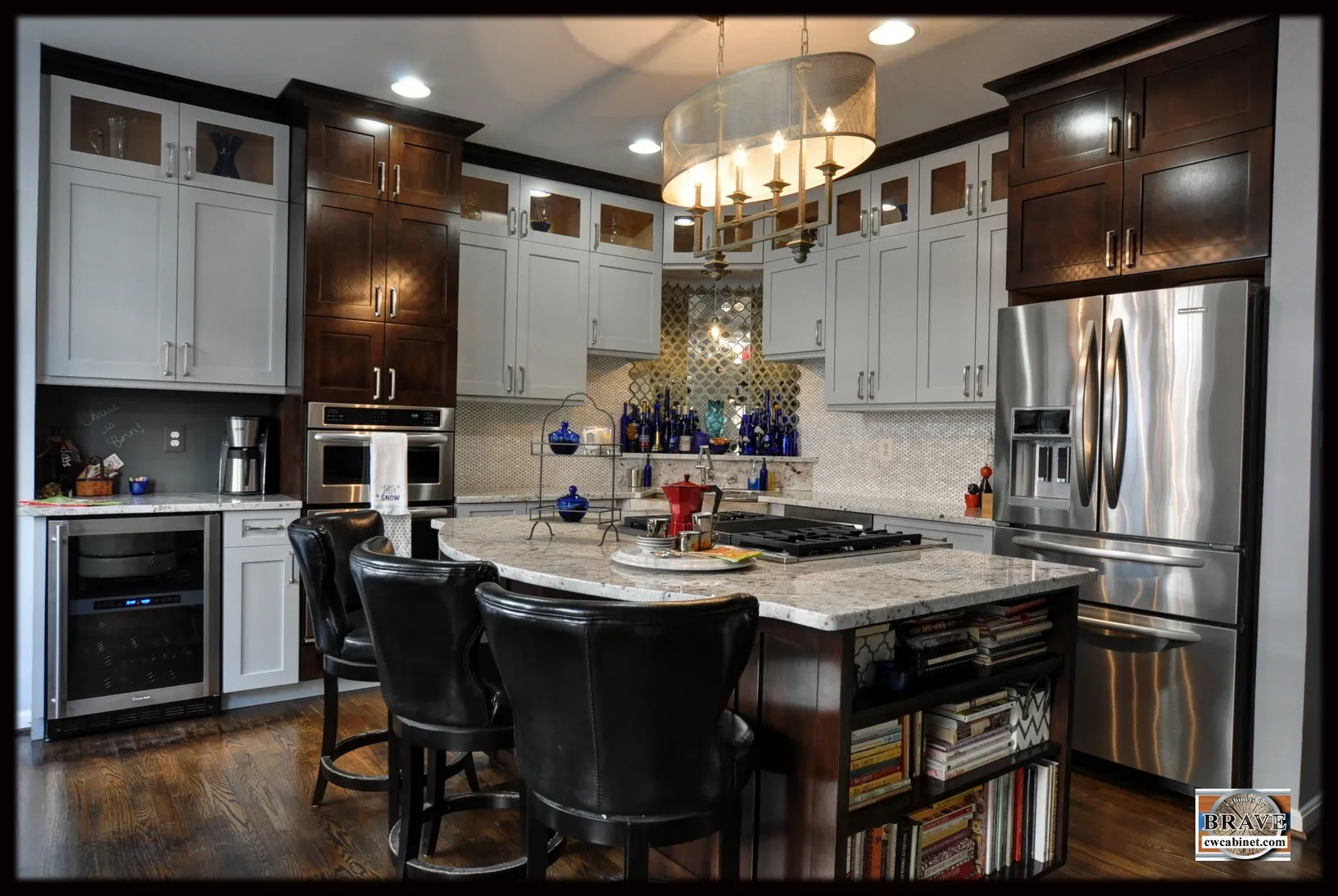 A kitchen with stainless steel appliances and white cabinets
