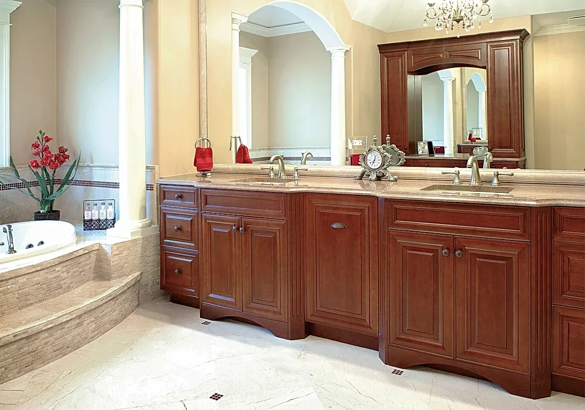 A bathroom with two sinks and two mirrors