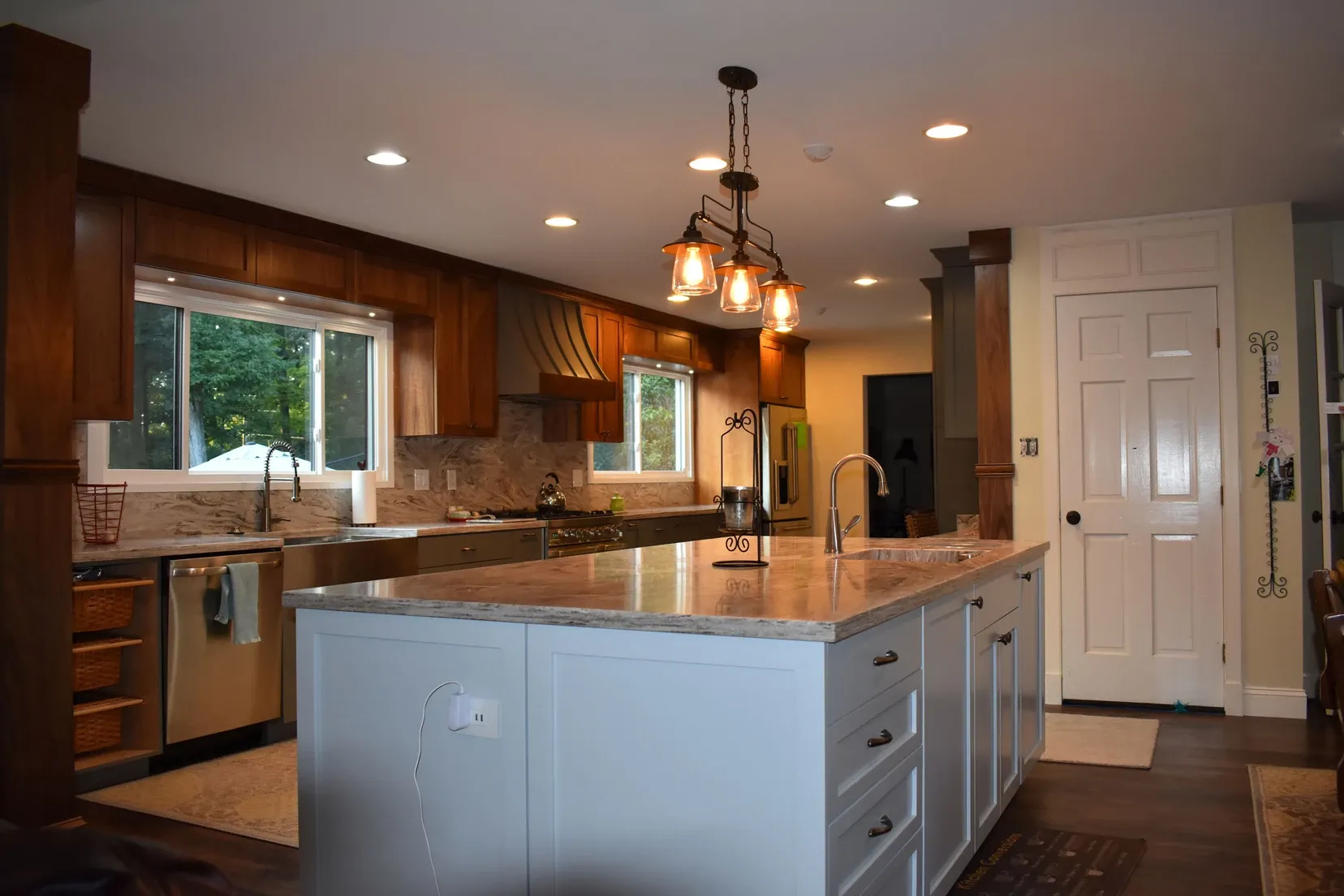 A kitchen with a large island in the middle