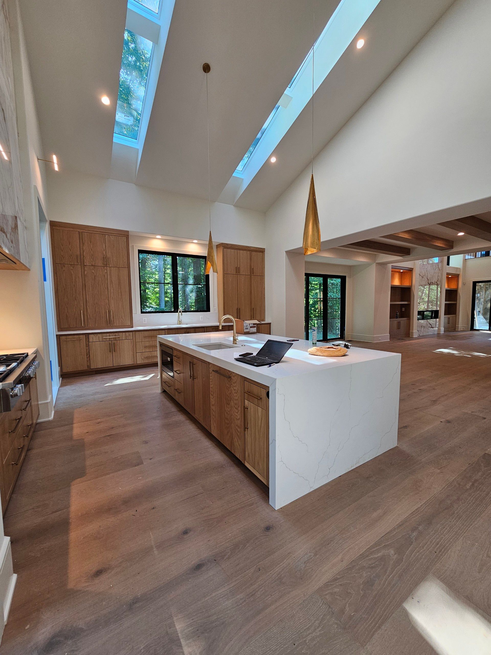 A kitchen with a large island in the middle