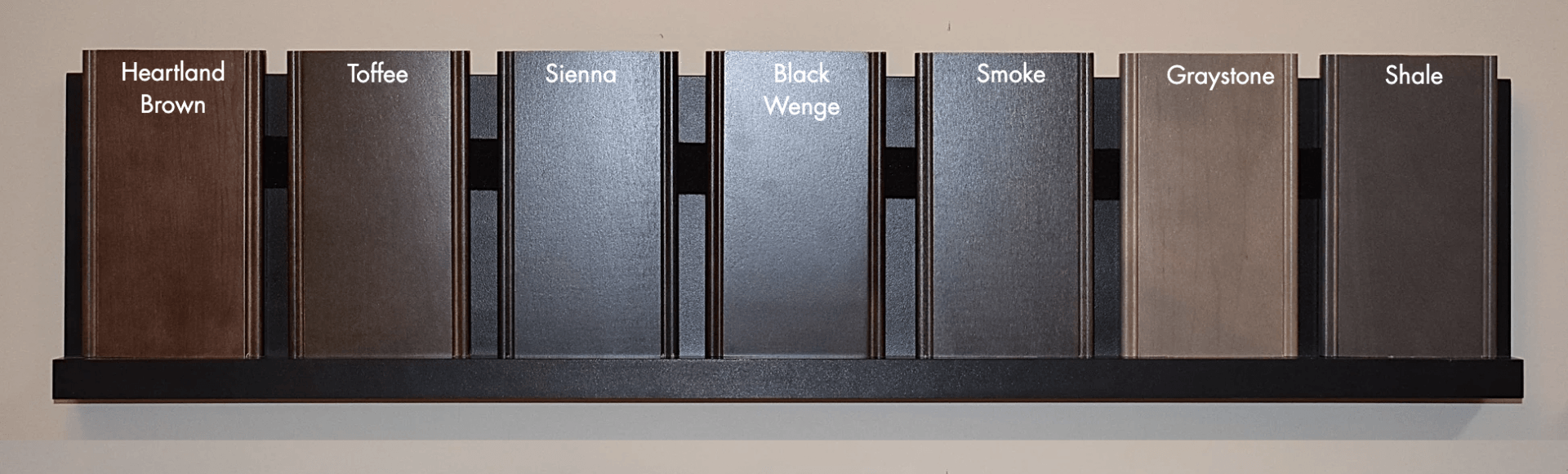 A shelf with a row of different colored blocks on it