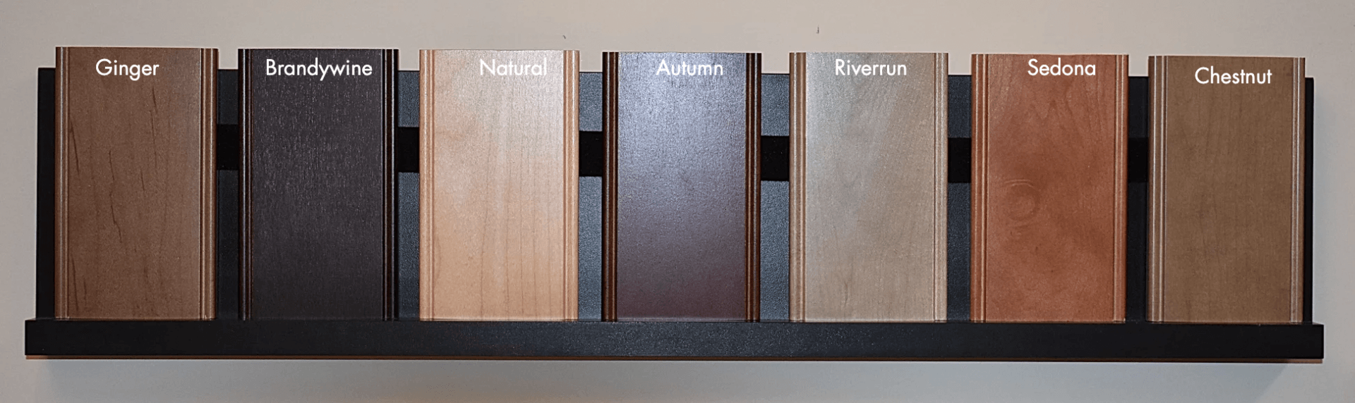 A row of wood samples with one that says ' brown ' on it