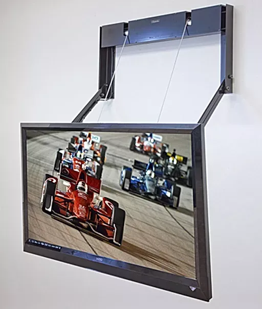 A flat screen tv shows a race car on the screen