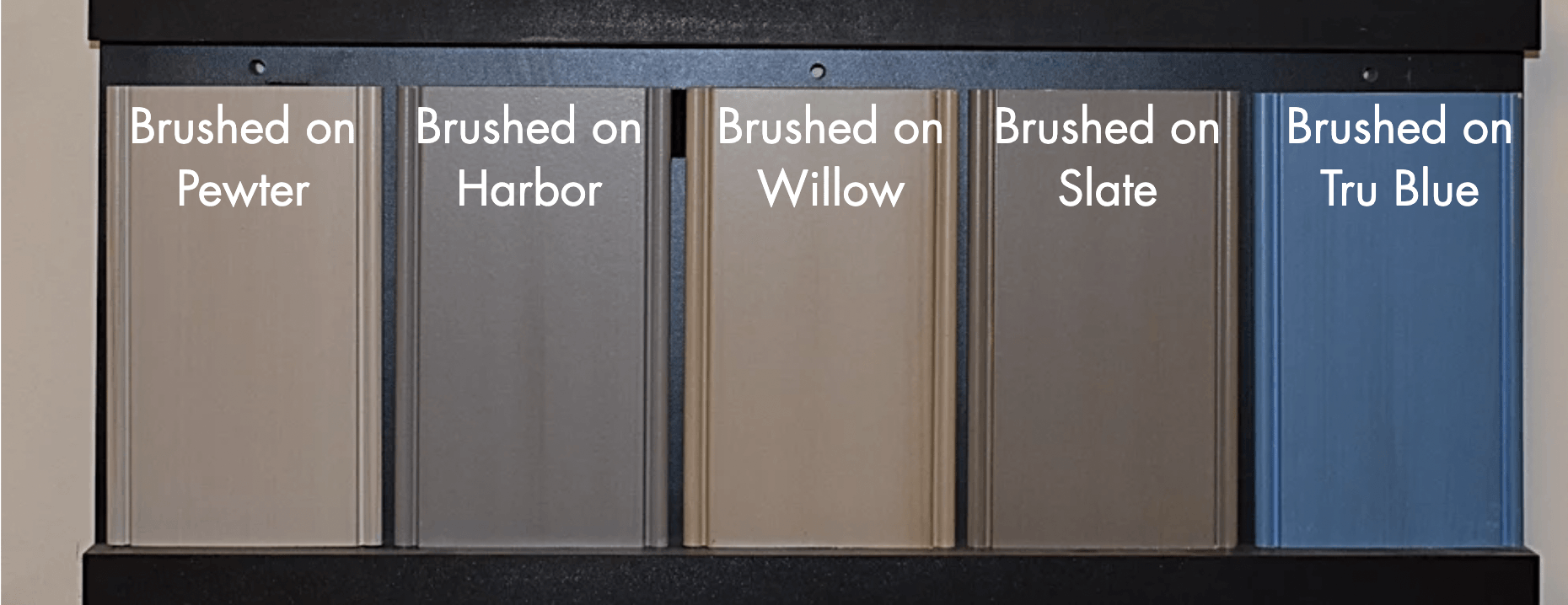 A row of aluminum siding with different shades of brushed on