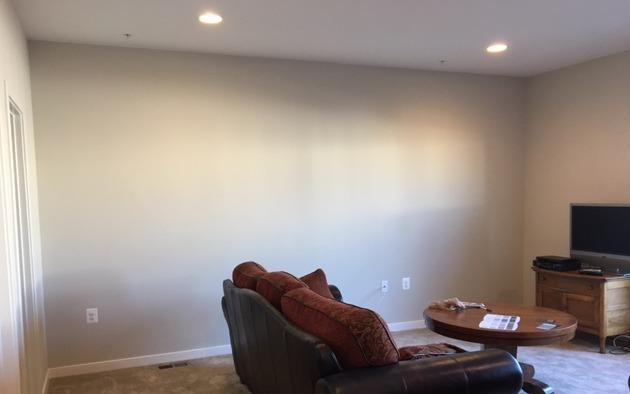 A living room with a couch , table , and television.