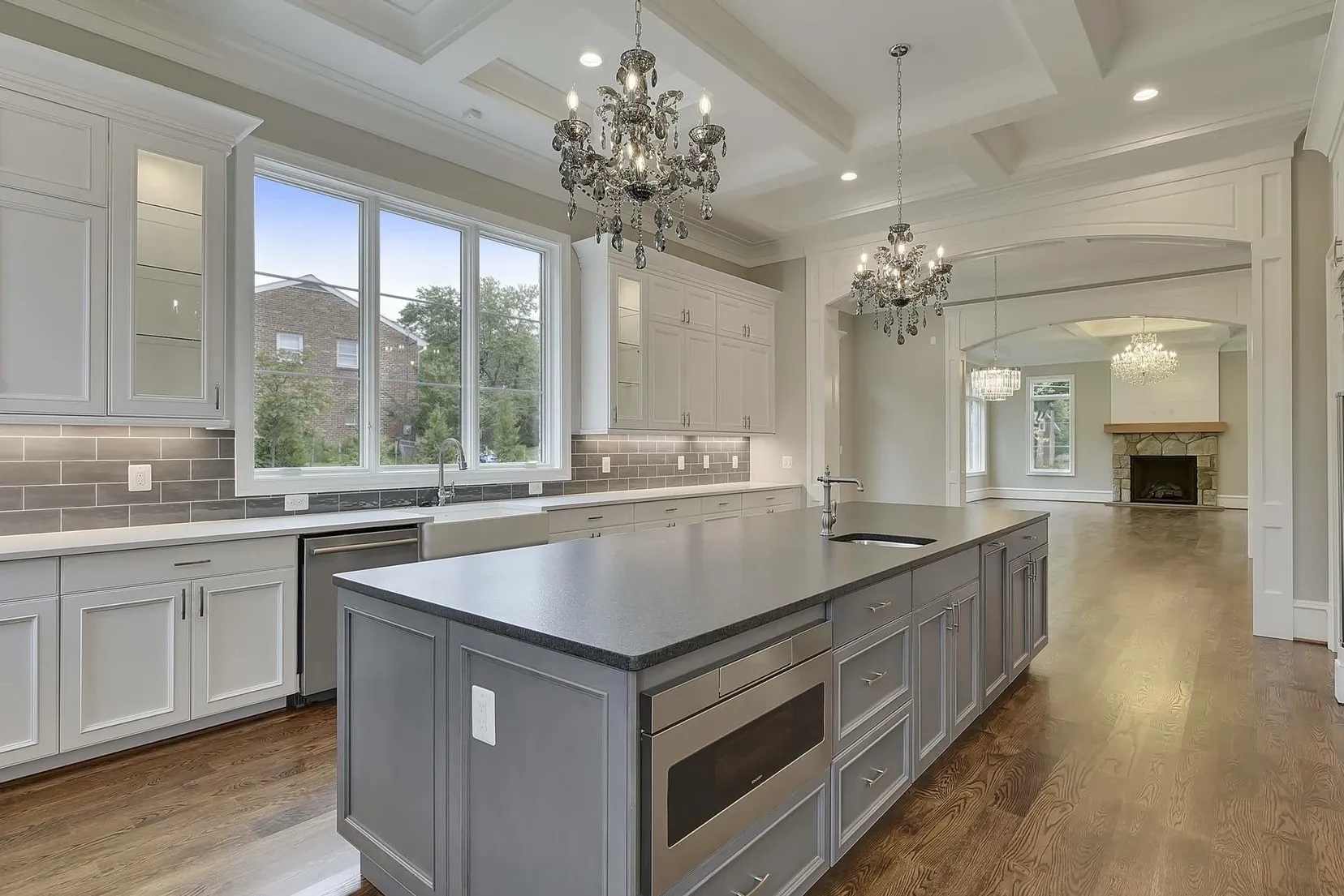 A large kitchen with a large island in the middle