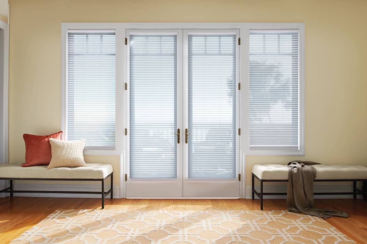 White Hunter Douglas Duette® Cellular Shades adorning a set of white French Doors near Sarasota, FL