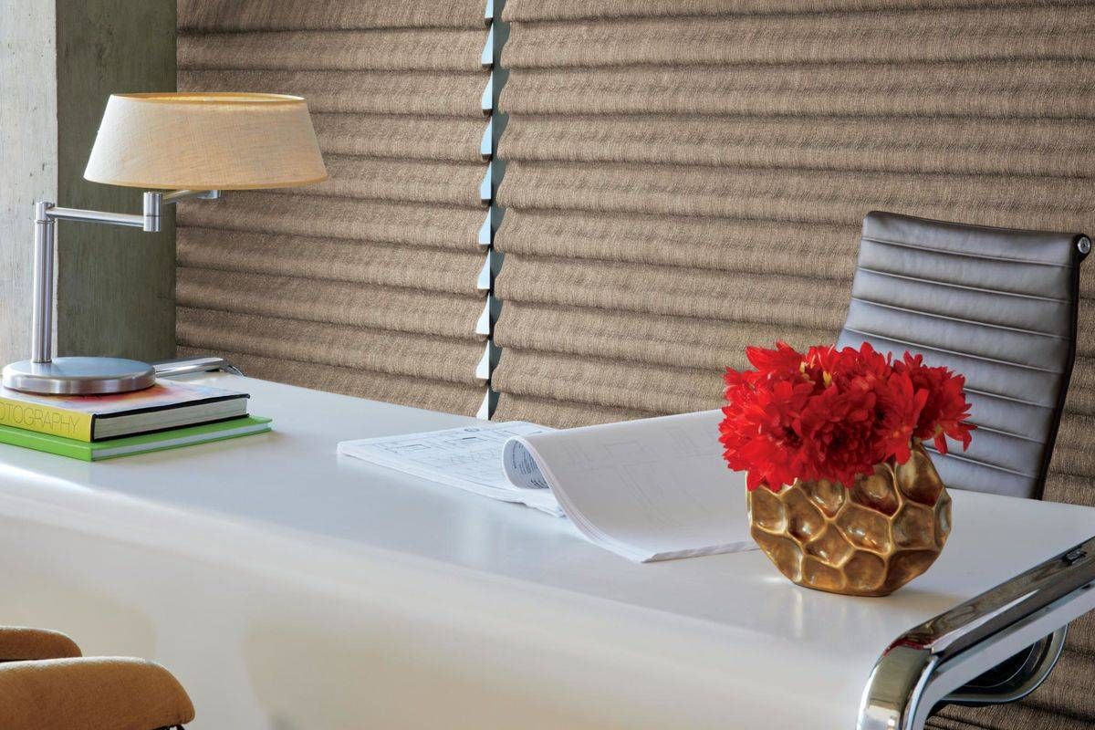 Hunter Douglas Vignette® Roman Shades hanging in a home office near Sarasota, FL
