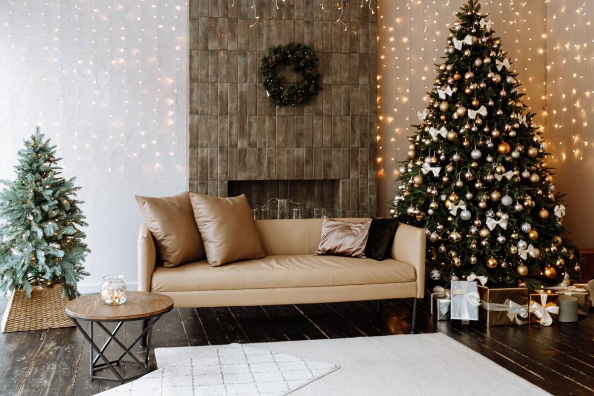 A stylish and cozy living room with a faux leather couch in front of a fireplace at Divine Interiors Group near Lakewood Ranch, Florida (FL)