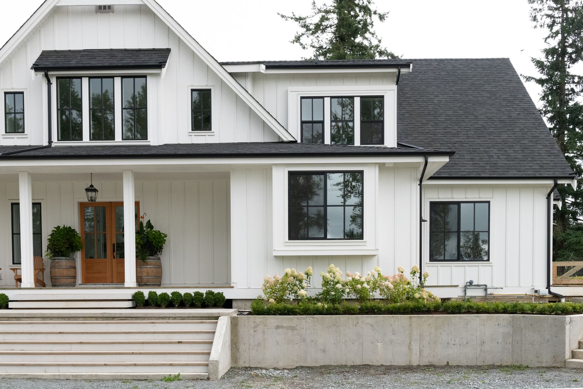 White farmhouse with black-framed windows