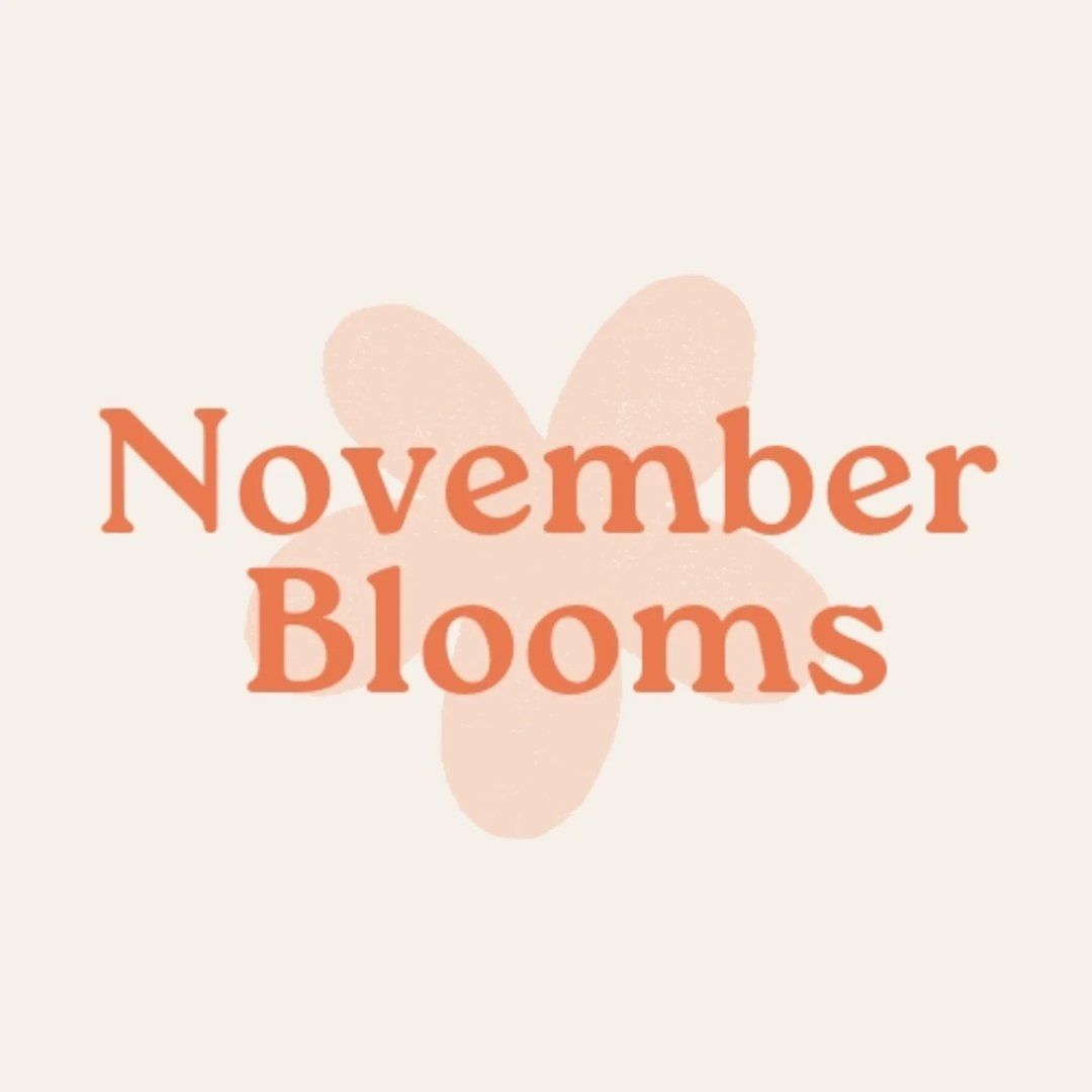 November Blooms text in coral over a pale peach flower shape on a cream background
