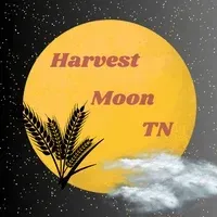 Harvest Moon TN logo with yellow moon, wheat stalks, and clouds on a starry night background