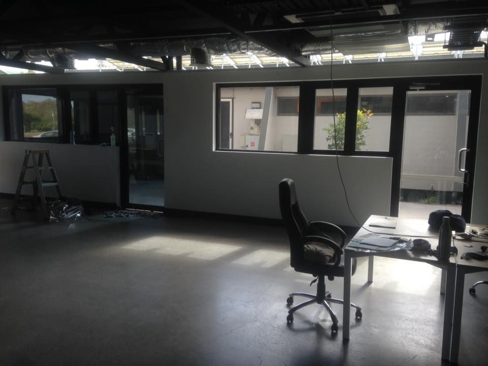 Inside the shop with office chair and table — Window Tinting in Noosaville QLD