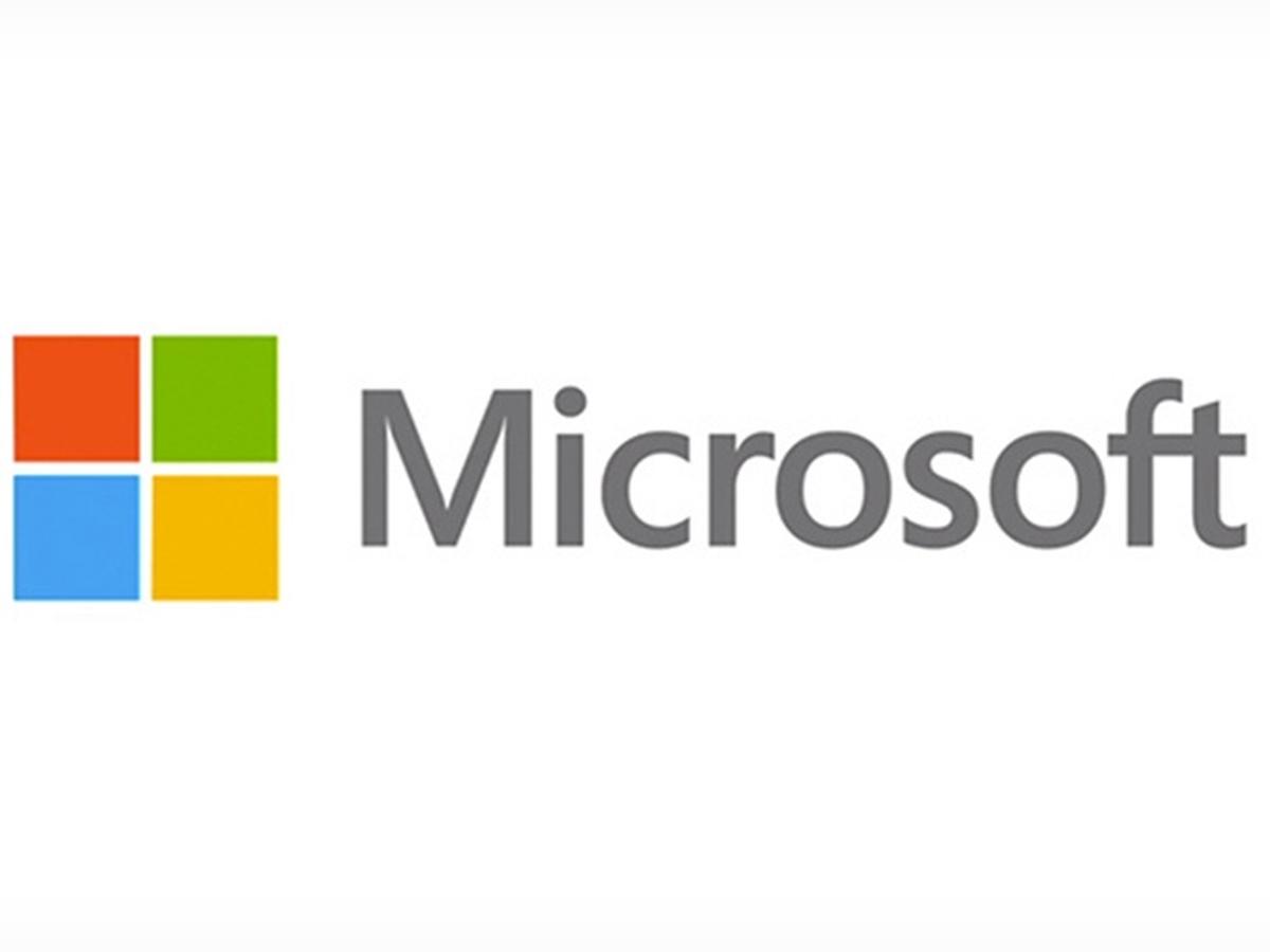Microsoft logo with four-color square icon and gray wordmark on a white background
