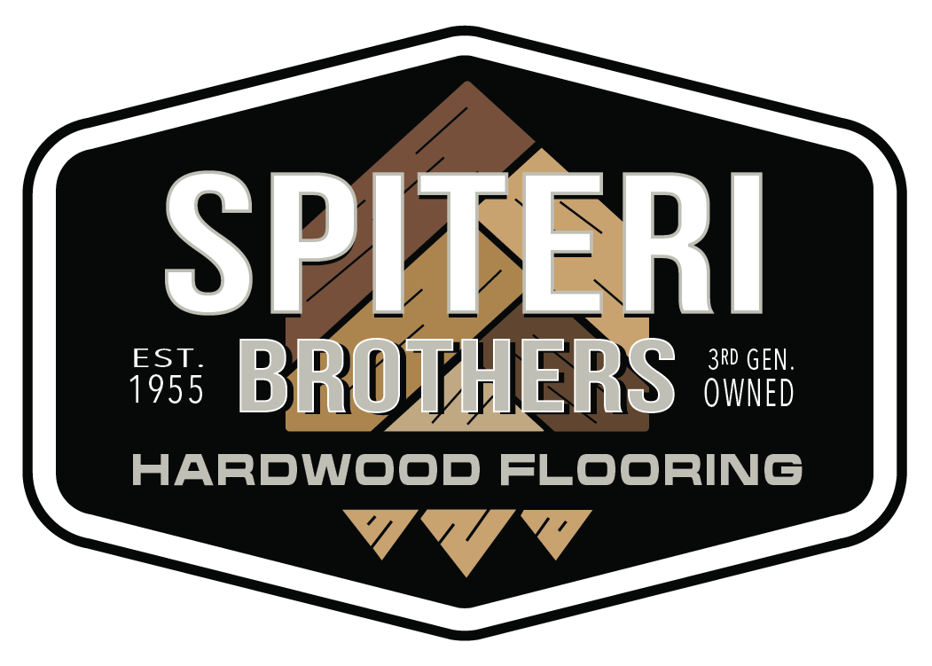 Spiteri Brothers Hardwood Flooring logo: brown circular emblem with a green stylized tree inside a light tan circle; text surrounds.