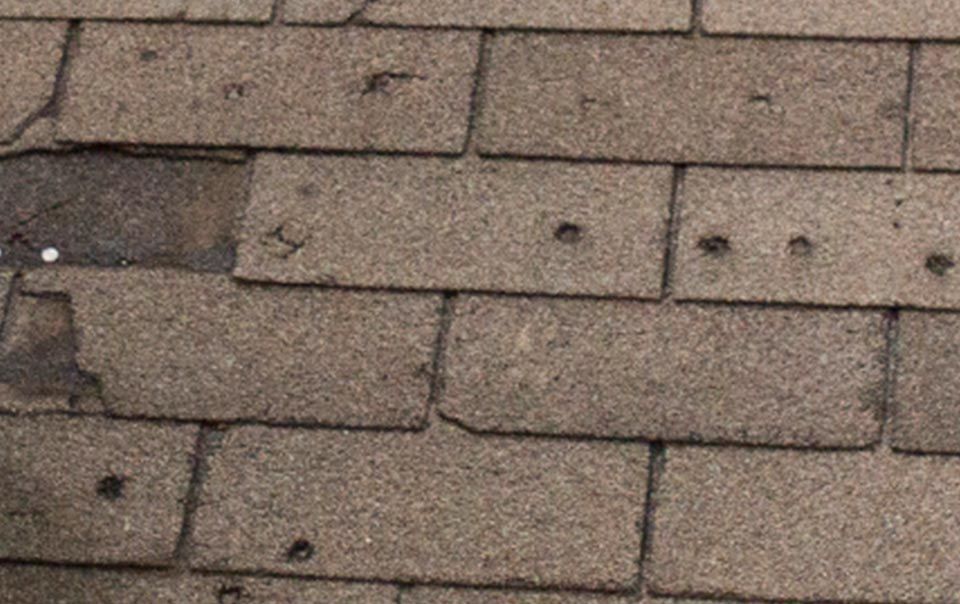 A close up of a roof with holes in it.