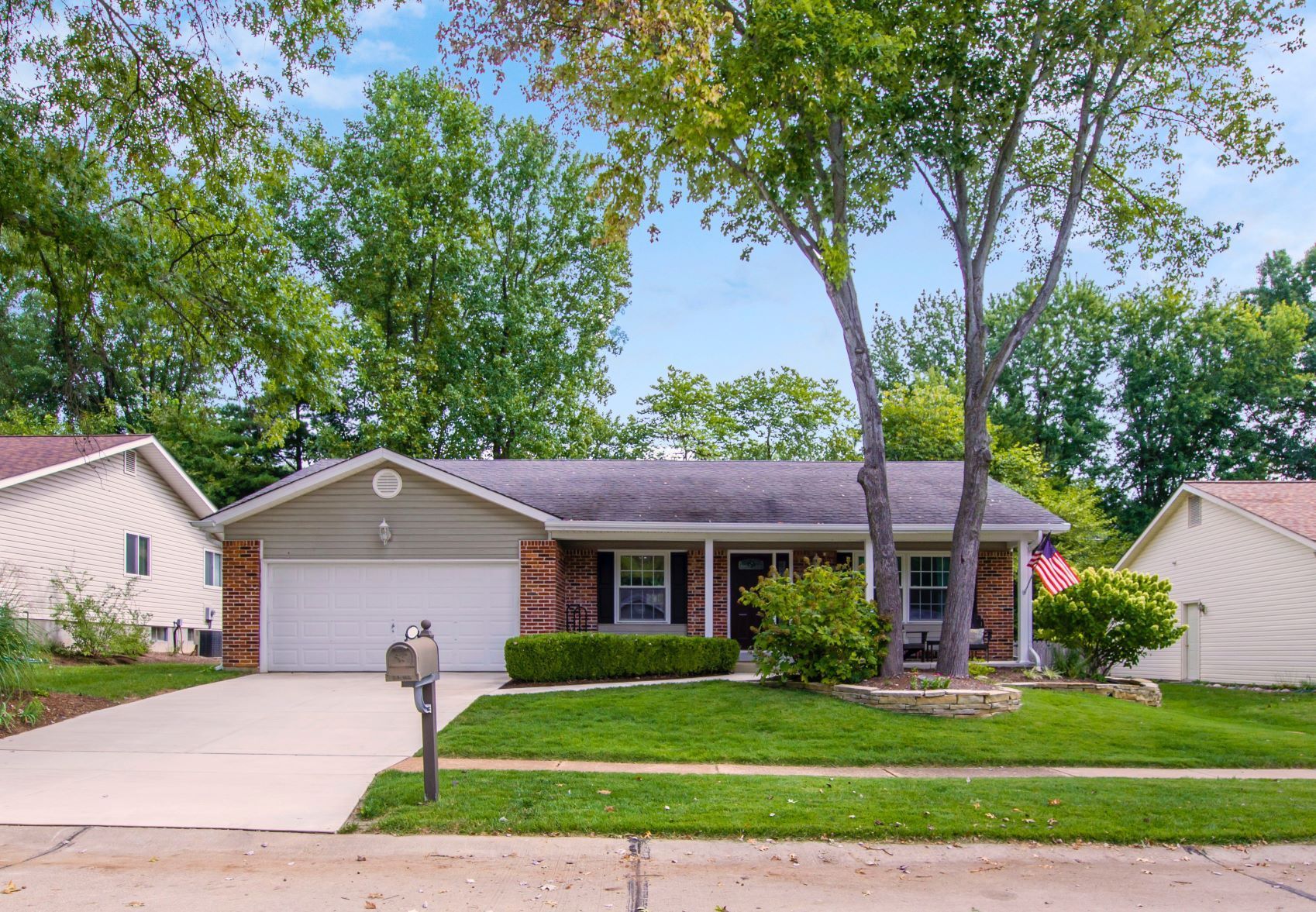 The front of a house with a white garage door