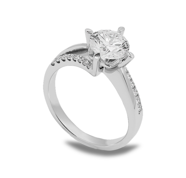 A white gold ring with a diamond in the center