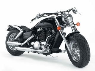 A black motorcycle with a large tire on a white background