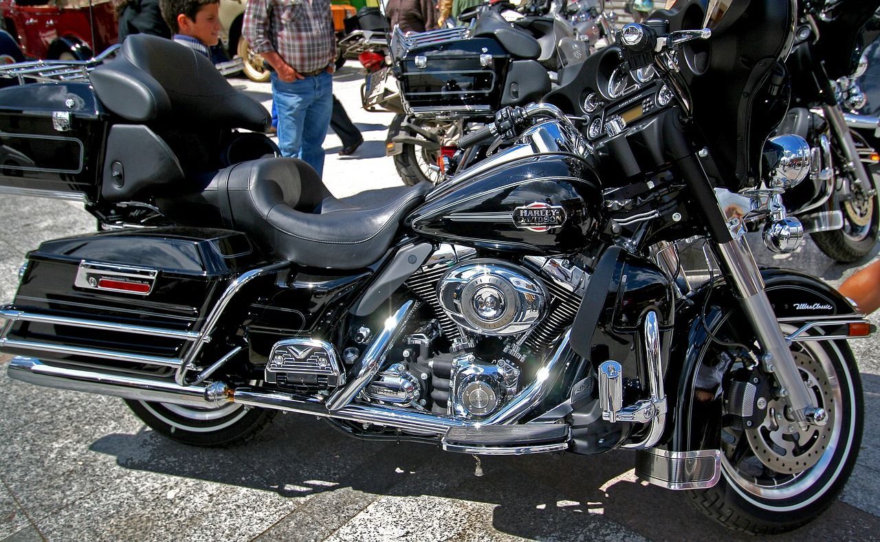 A harley davidson motorcycle is parked on the side of the road