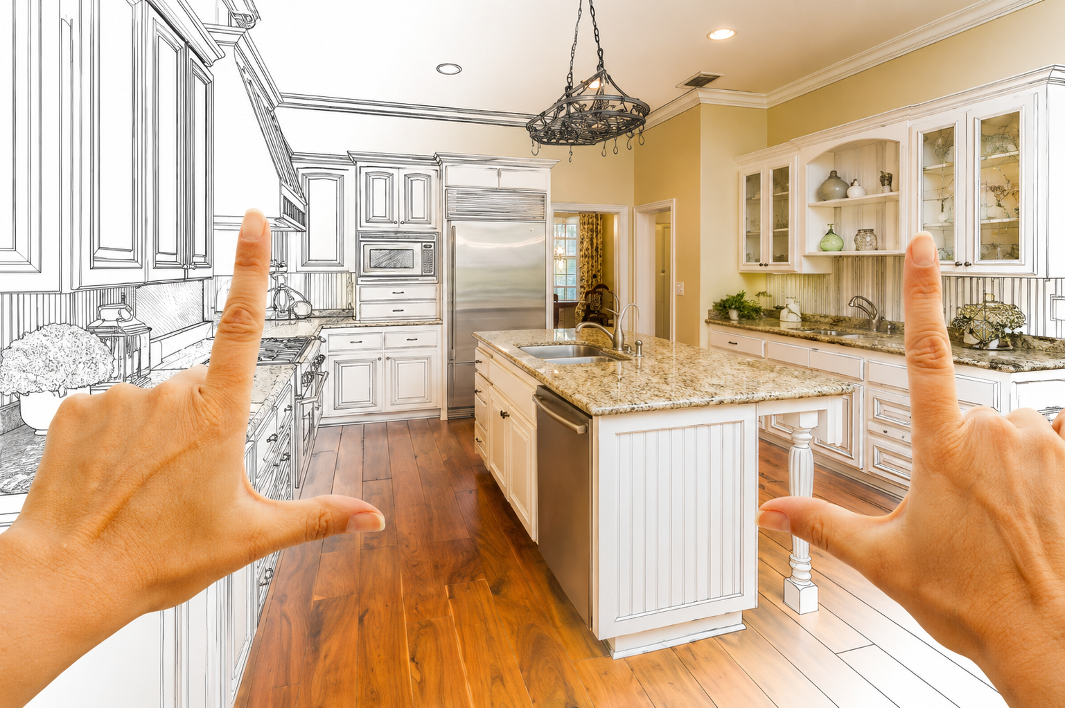 Hands framing a bright, modern kitchen with white cabinets, granite island, and hardwood floors